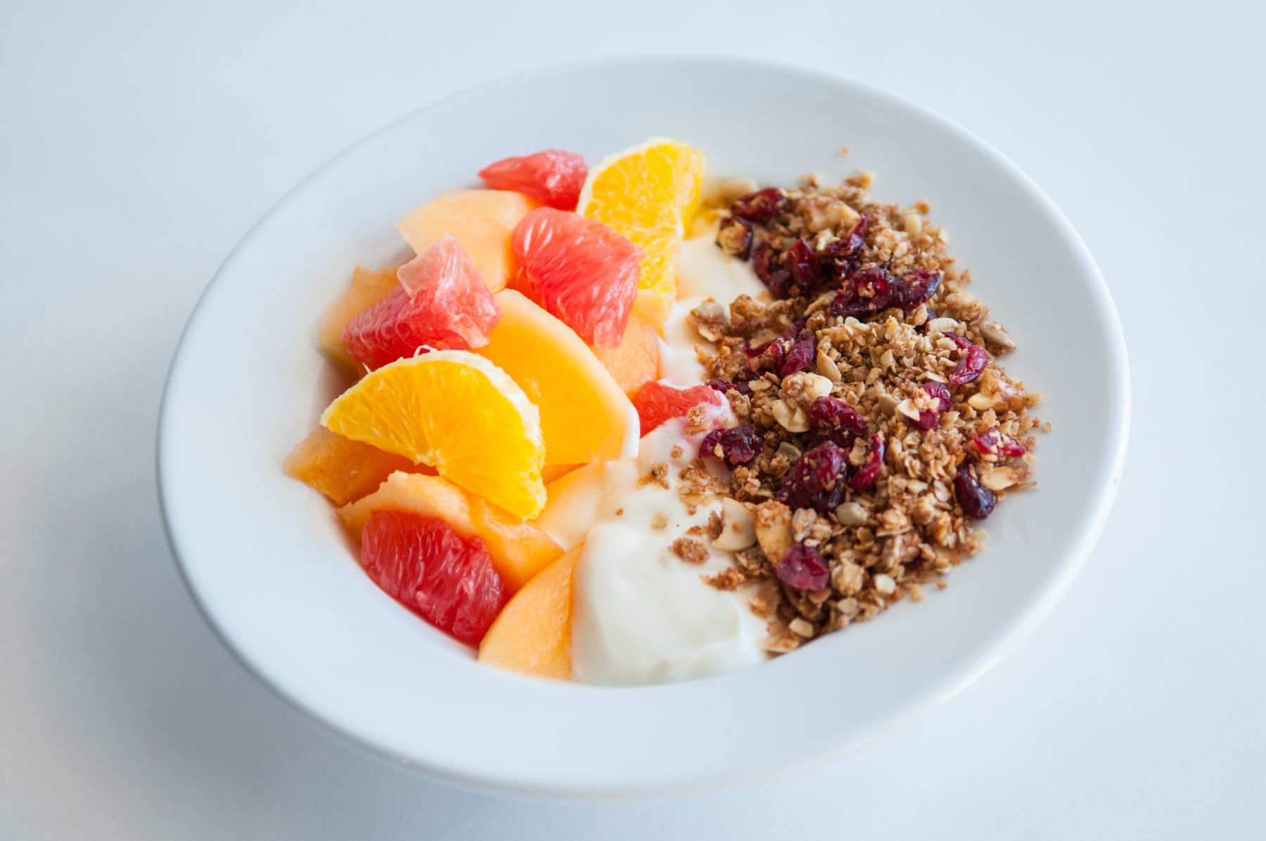 Fruit served with homemade granola and yogurt